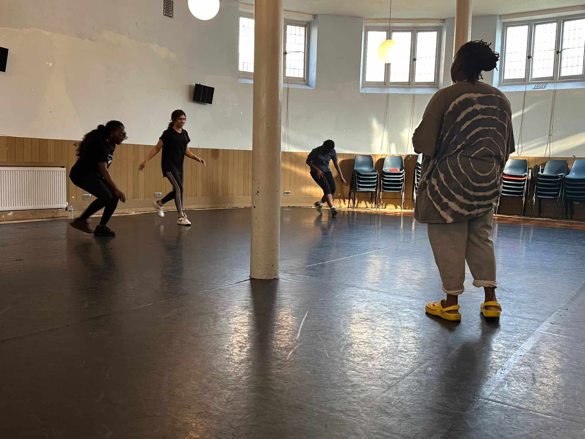 Jump rope fitness class with diverse participants in a spacious, well-lit indoor studio.