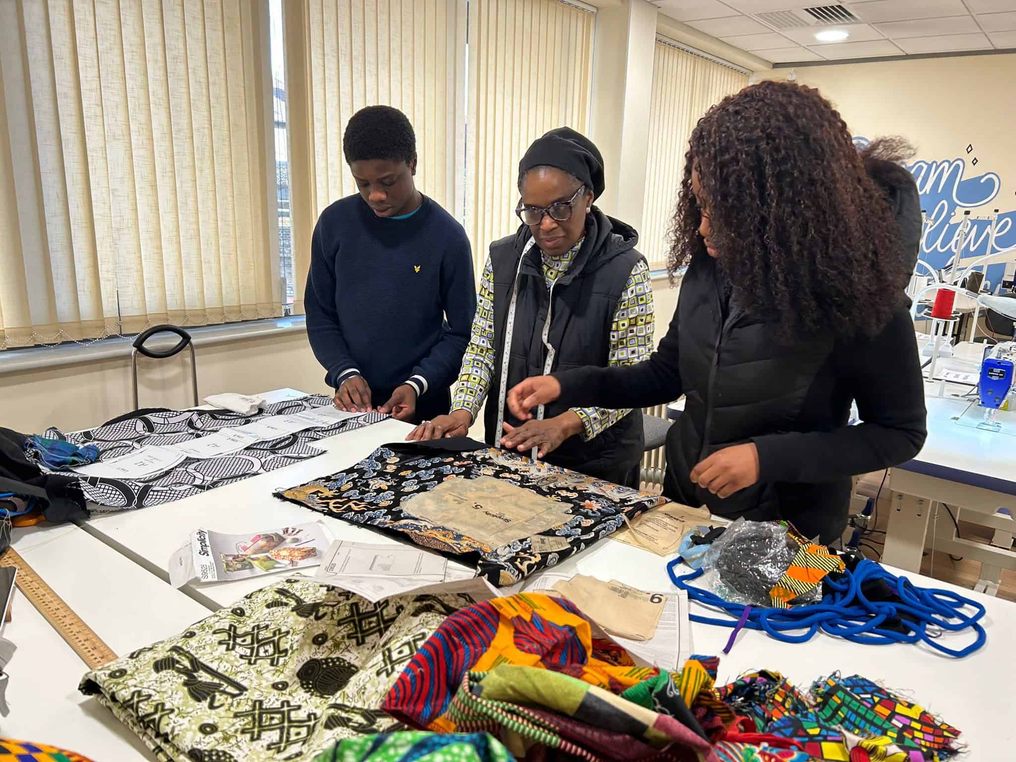 Community members working on fabric crafts at C4CWB workshop.